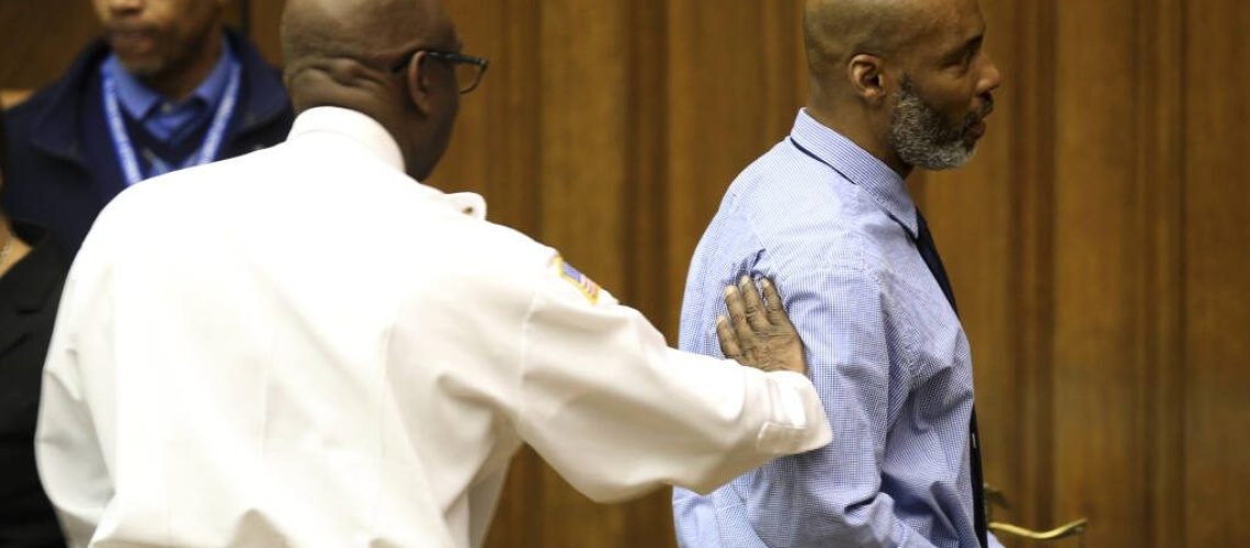 Lamar Johnson, right, gets a congratulatory pat on the shoulder from St. Louis Sherriif Vernon Betts on Tuesday, Feb. 14, 2023, after St. Louis Circuit Judge David Mason vacated Johnson's murder conviction during a hearing in St. Louis, Mo. Johnson served nearly 28 years of a life sentence for a killing that he has always said he didn't commit. (Christian Gooden/St. Louis Post-Dispatch via AP, Pool)